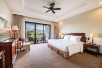 a hotel room with a bed and a balcony at Vinpearl Resort & Spa Phu Quoc in Phú Quốc