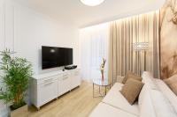 Televízia a/alebo spoločenská miestnosť v ubytovaní Aquabaltic Apartments Aquarius II