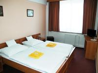 Postel nebo postele na pokoji v ubytování Hotel Vysocina