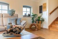 Posezení v ubytování Ferienhaus Strandgut - Reetdachhaus in Strandnähe