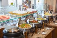 a buffet line with many different types of food at Ming Ging Farm in Ren&#39;ai