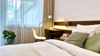 Postel nebo postele na pokoji v ubytování Unsereins Hotel