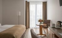 Postel nebo postele na pokoji v ubytování Hotel Chrisma