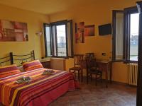 Posteľ alebo postele v izbe v ubytovaní Casa di Campagna B&B La Corte Ferrara
