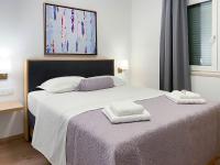 Posteľ alebo postele v izbe v ubytovaní Marisa Apartments Hvar II