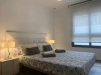 Posteľ alebo postele v izbe v ubytovaní Apartamento de lujo en primera linea de playa