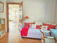 a bedroom with a bed with red pillows at Villa Saint Kirio - piscine et spa in Morlaix