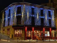 a building with blue lights on the side of it at Marinha Hotel in Gentilly