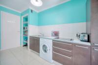 a kitchen with a washing machine and a sink at IMMOGROOM - Renovated apartment - Terrace - AC in Cannes