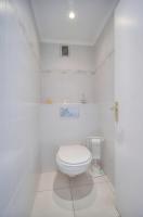 a white bathroom with a toilet in a room at IMMOGROOM - Renovated apartment - Terrace - AC in Cannes