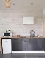 Kuchyňa alebo kuchynka v ubytovaní Maison proche la Rochelle