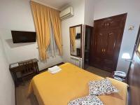 A bed or beds in a room at Hostal Edreira