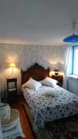 Tempat tidur dalam kamar di La maison d&#39;Apolline