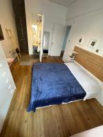 A bed or beds in a room at Harmony Luxury Grand Suite