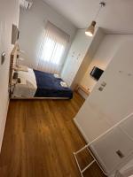 A bed or beds in a room at Harmony Luxury Grand Suite