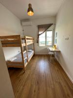 A bed or beds in a room at Harmony Luxury Grand Suite
