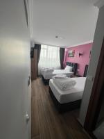 Postel nebo postele na pokoji v ubytování MİRHAN HOTEL