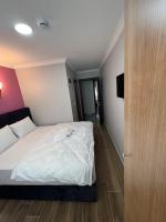 Postel nebo postele na pokoji v ubytování MİRHAN HOTEL