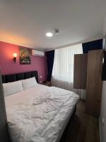 Postel nebo postele na pokoji v ubytování MİRHAN HOTEL