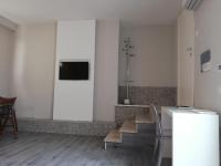 Televízia a/alebo spoločenská miestnosť v ubytovaní Guest House Piazza Bologna
