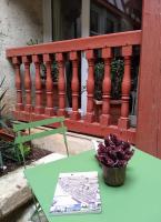 a green table with a book on a balcony at Passage du Cygne in Blois