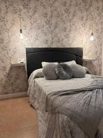 Posteľ alebo postele v izbe v ubytovaní Apartamentos Esencia