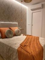 Posteľ alebo postele v izbe v ubytovaní Apartamentos Esencia