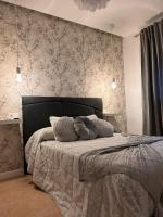 Posteľ alebo postele v izbe v ubytovaní Apartamentos Esencia