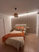 Posteľ alebo postele v izbe v ubytovaní Apartamentos Esencia