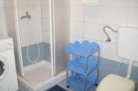 a bathroom with a shower with a blue shelf next to a toilet at Apartments by the sea Cres - 8095 in Cres