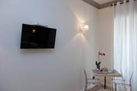Televízia a/alebo spoločenská miestnosť v ubytovaní Rome Eternal City