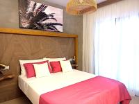 A bed or beds in a room at Cloud Tropical - Piscina climatizada - Gym Privado