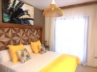 A bed or beds in a room at Cloud Tropical - Piscina climatizada - Gym Privado