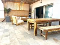 A seating area at Cloud Tropical - Piscina climatizada - Gym Privado