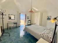 A bed or beds in a room at Giardino Eden Villa