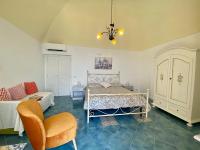 A bed or beds in a room at Giardino Eden Villa