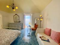 A bed or beds in a room at Giardino Eden Villa