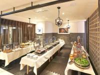 a buffet line of tables with food on them at APA Hotel Shinjuku Kabukicho Tower in Tokyo