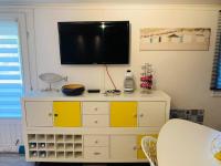 Telewizja i/lub zestaw kina domowego w obiekcie Appart cocooning avec parking gratuit & wifi