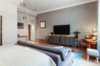 Televízia a/alebo spoločenská miestnosť v ubytovaní 3on7 Apartments