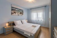 Posteľ alebo postele v izbe v ubytovaní Apartman Bella Vita