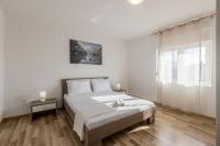 Posteľ alebo postele v izbe v ubytovaní Apartman Bella Vita