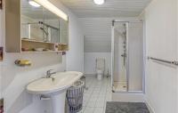 a white bathroom with a sink and a toilet at Gorgeous Home In Pierrefiche With House A Panoramic View in Pierrefiche