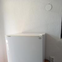 a white refrigerator with a shelf on top of it at Kuca za odmor-P- in Visoko