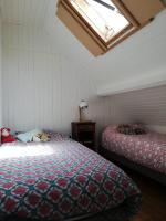 Łóżko lub łóżka w pokoju w obiekcie KER HUELLA - Superbe vue mer et accès plage privé