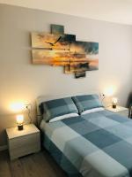 A bed or beds in a room at Opalia Residence - Stella Garda Lake Lifestyle