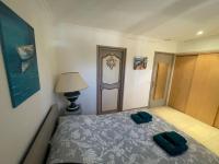 Łóżko lub łóżka w pokoju w obiekcie Charmante villa avec grande piscine au calme