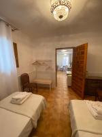 Posteľ alebo postele v izbe v ubytovaní Apartamentos Toledo Casa Galería de los Aljibes