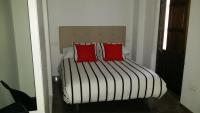 A bed or beds in a room at Apartamentos Ilíberis