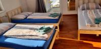 three bunk beds in a room with a window at Dimai House No 15 Dornbirn Zentrum in Dornbirn